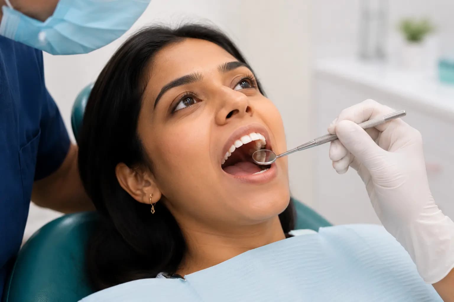 Dentist plucking tooth